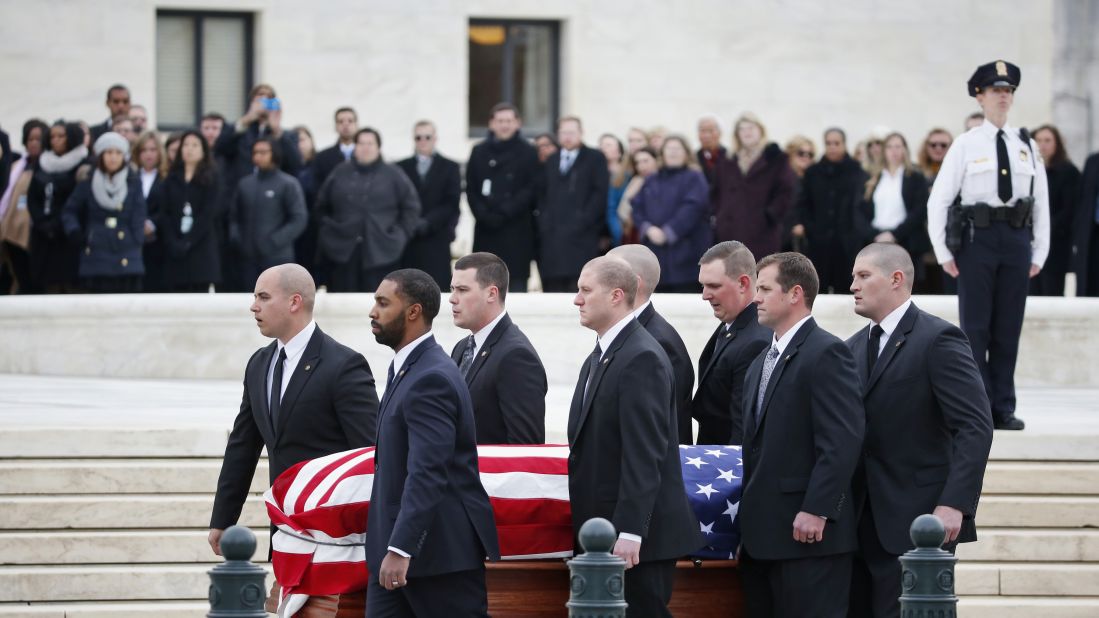Pallbearers carry Scalia's casket on February 19.