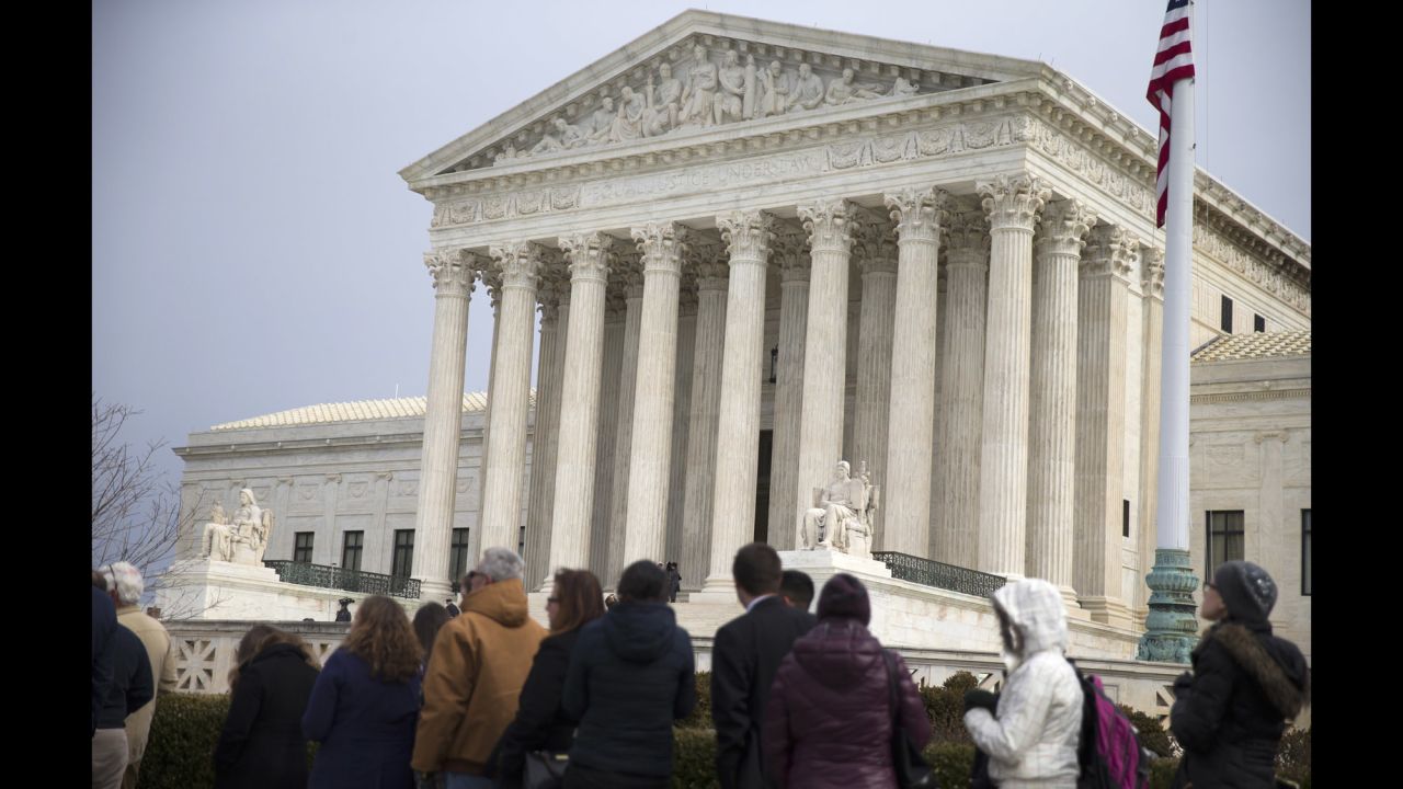 People wait in line outside the Supreme Court on February 19.