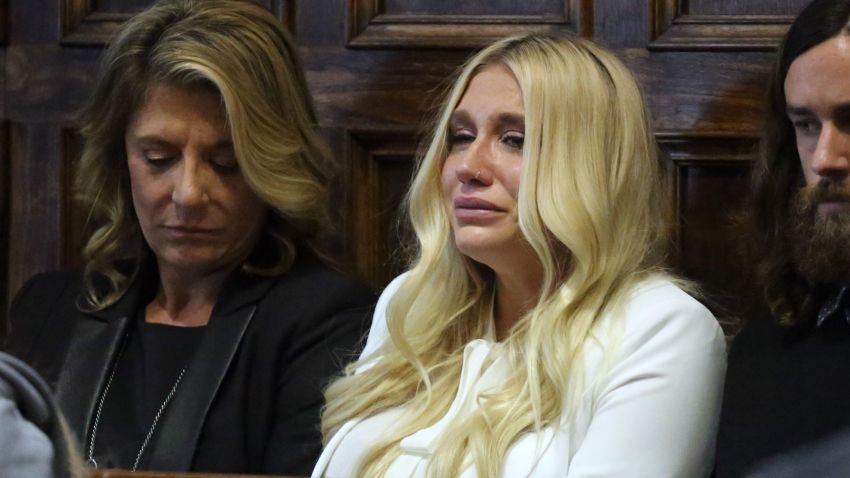 (Pool photo by Jefferson Siegel) - Kesha (center in white) cries as she learns she will not be released from her record label contract in Manhattan Supreme Court on Friday, February 19, 2016. A judge said she would not allow Kesha to leave her record label. (Pool Photo by Jefferson Siegel/NY Daily News via Getty Images)