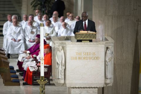 Justice Clarence Thomas delivers a reading during the funeral Mass fo February 20. 