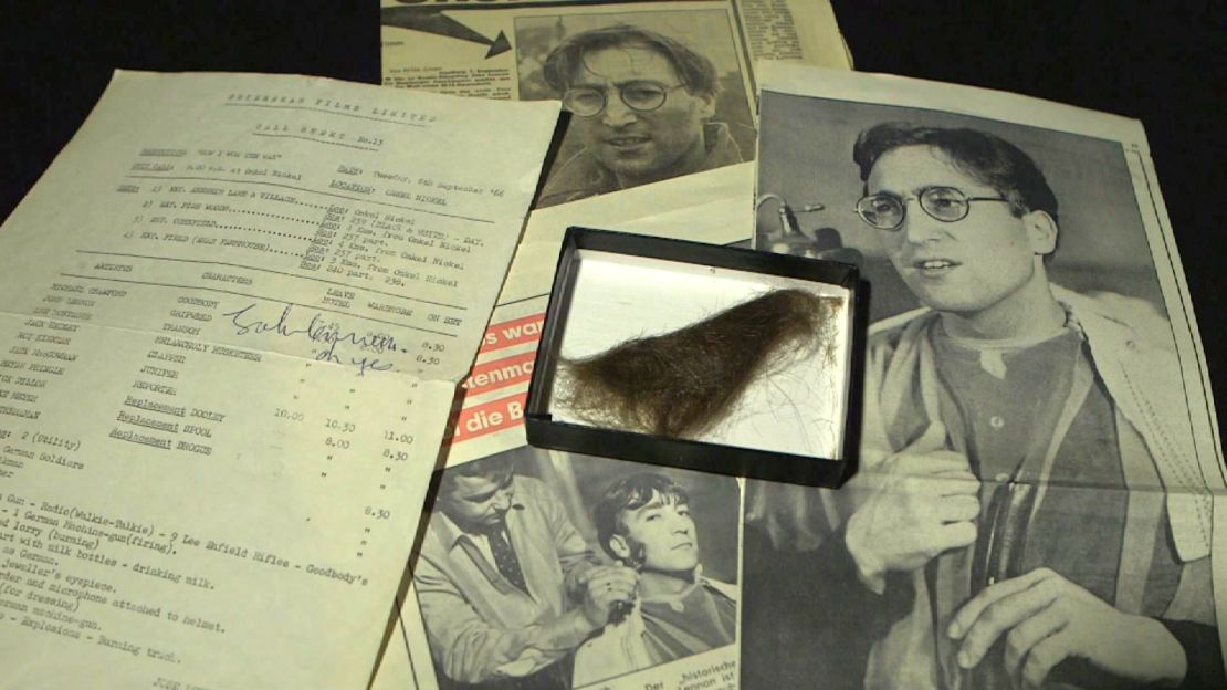 A lock of John Lennon's hair sold Saturday for $35,000. Included were two vintage newspapers and a signed call sheet.