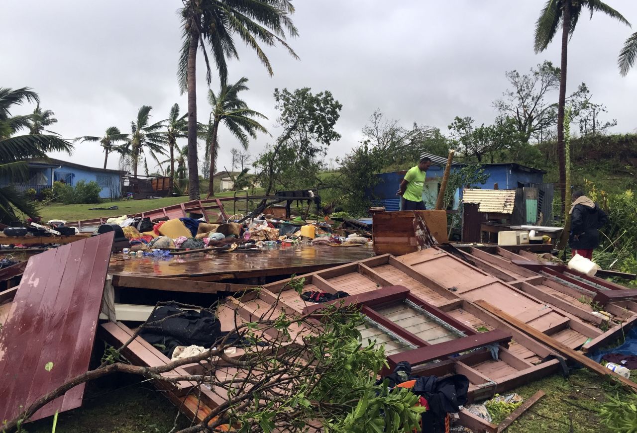 A man looks through the remains of a home in the town of Ba, Fiji, on February 21, after it was leveled by Tropical Cyclone Winston.