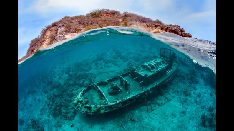 Thomas Heckmann ccaptured "A Family Affair," which shows a shipwreck with the island of Curacao in the background. He got this shot while swimming with his young daughter, Maja. 