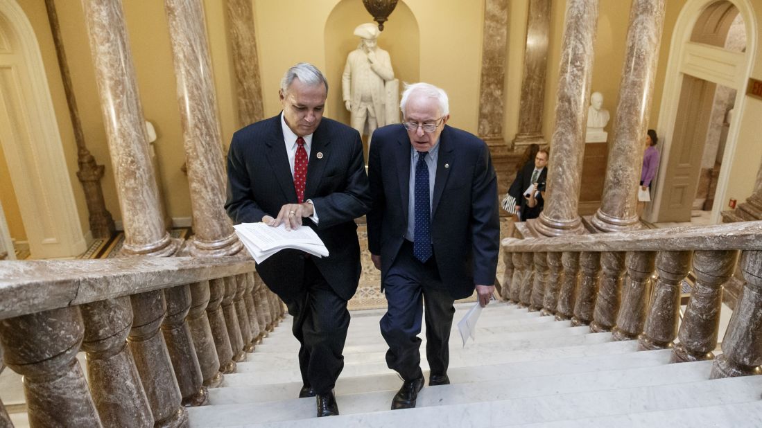 Sanders and US Rep. Jeff Miller, chairman of the House Committee on Veterans' Affairs, walk to a news conference on Capitol Hill in 2014. Sanders was chairman of the Senate Committee on Veterans' Affairs.