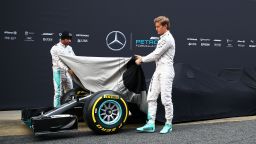 MONTMELO, SPAIN - FEBRUARY 22:  Lewis Hamilton of Great Britain and Mercedes GP and Nico Rosberg of Germany and Mercedes GP unveil the new W07 car outside the garage during day one of F1 winter testing at Circuit de Catalunya on February 22, 2016 in Montmelo, Spain.  (Photo by Mark Thompson/Getty Images)