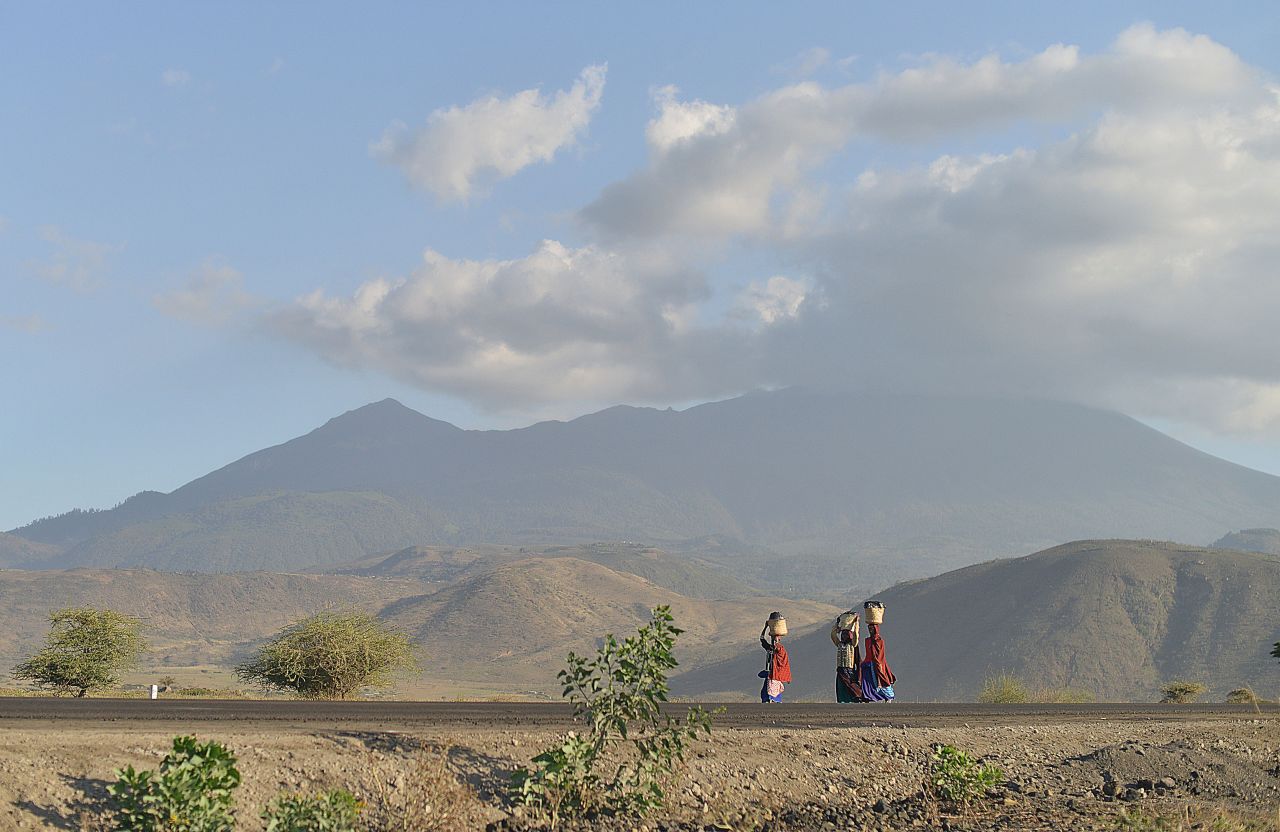 Maasai women carry water near the border of Kenya and Tanzania. "Women spend an average of four-and-a-half hours doing unpaid work every day, compared to an average of about two hours per day for men," say Bill and Melinda Gates.