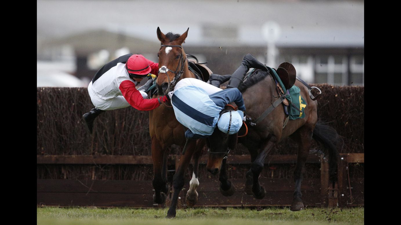Victoria Pendleton, left, and Carey Williamson fall off their horses during a steeplechase race in Fakenham, England, on Friday, February 19. Pendleton is a former Olympic cyclist who won the keirin at the 2012 Games.