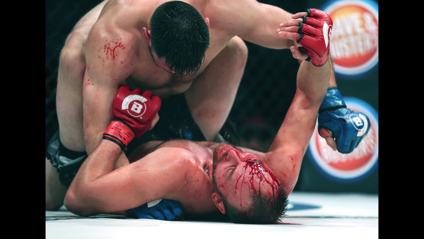 C.J. Hancock, bottom, tries to hold off Ruben Esparza during their Bellator bout in Houston on Friday, February 19. Hancock would win the fight with a rear-naked choke in the third round.