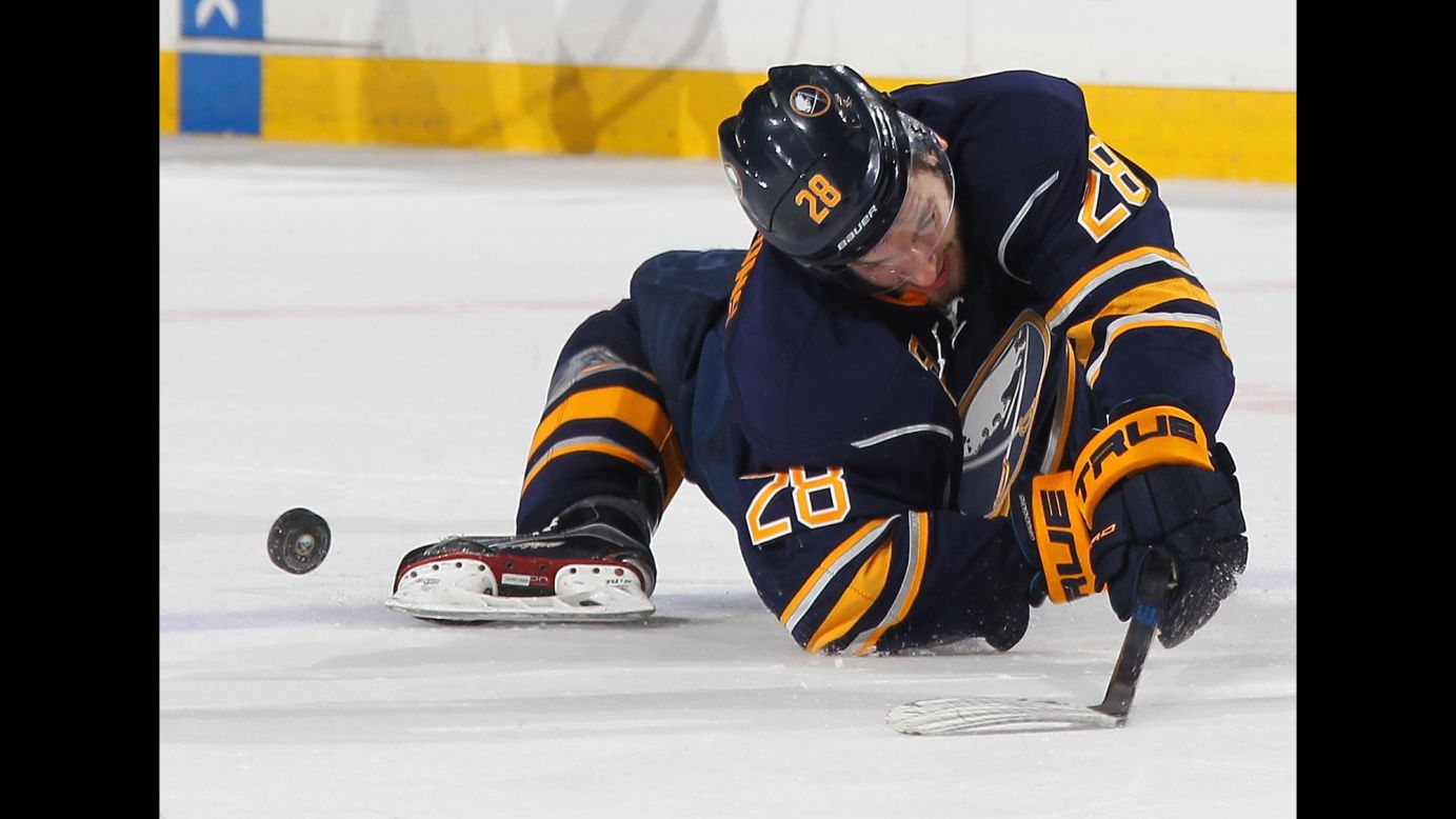Zemgus Girgensons falls awkwardly after colliding with a Pittsburgh player in Buffalo, New York, on Saturday, February 21.