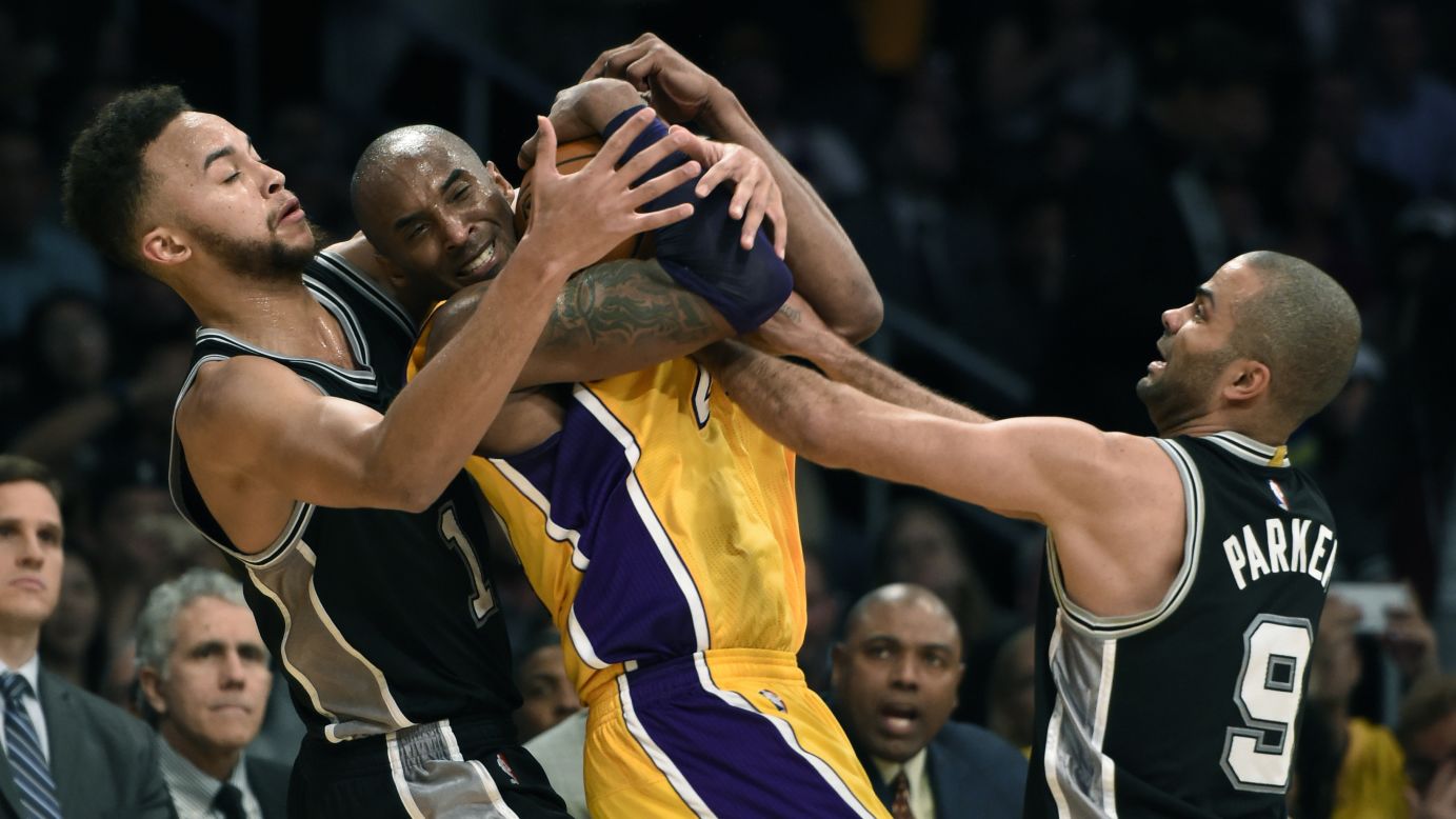 Kobe Bryant is swarmed by San Antonio's Kyle Anderson and Tony Parker during an NBA game in Los Angeles on Friday, February 19.