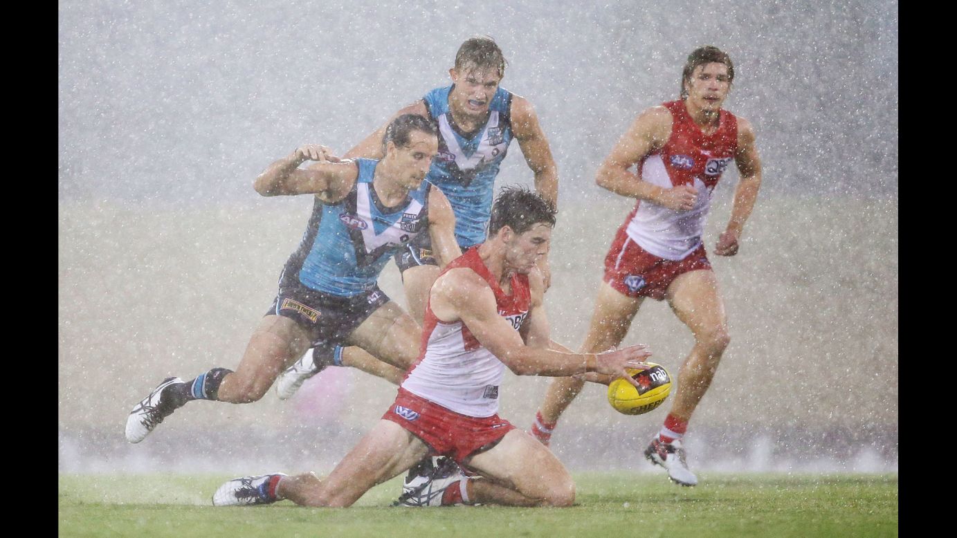 George Hewett of the Sydney Swans is tackled during an Australian Football League match against the Port Adelaide Power on Saturday, February 20.