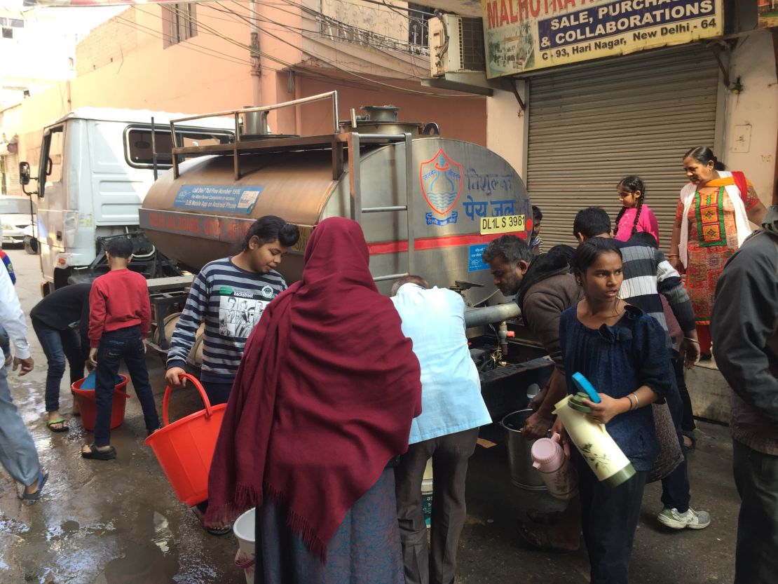 Residents collect water from a tanker in West Delhi.