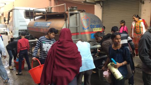 Residents collect water from a tanker in West Delhi.