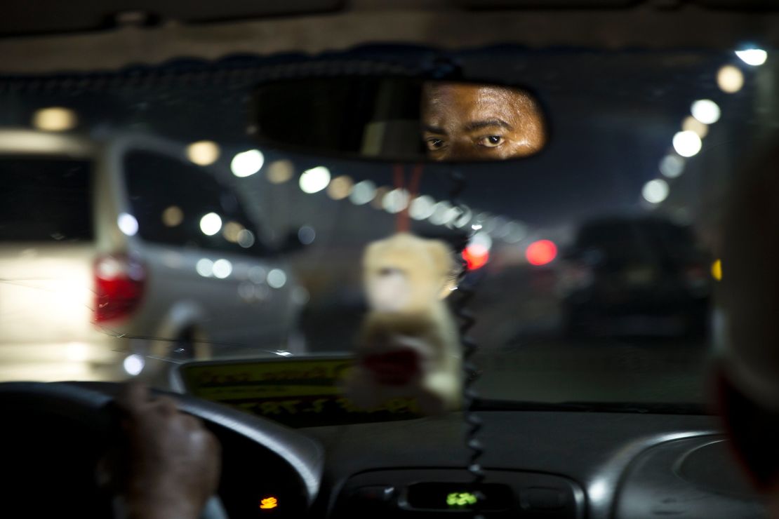 A Dominican taxi driver contends with Santo Domingo traffic. Immigration seemed to be on everyone's mind.