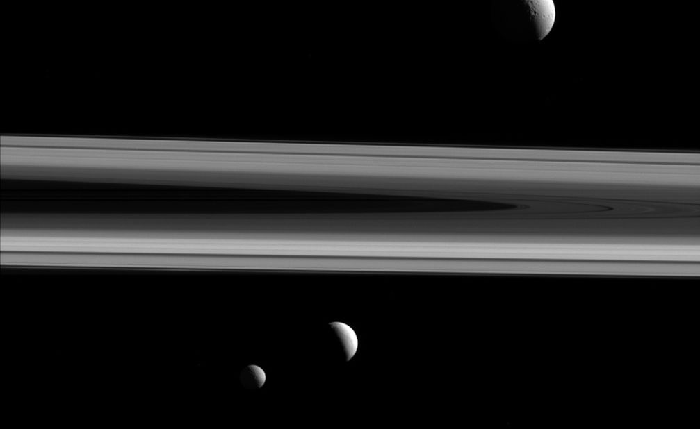 Saturn's moons Tethys, Enceladus and Mimas are shown in this image taken by the Cassini spacecraft on December 3, 2015. Tethys is above the rings, Enceladus is below the rings in the center of the image, and Mimas is below and to the left. Cassini has been exploring Saturn and its moons since 2004. The mission is scheduled to end in September 2017.