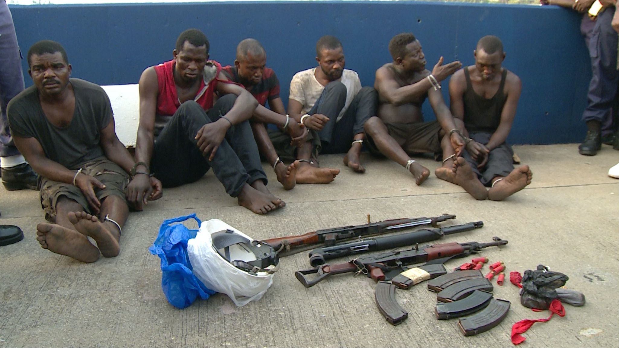 The suspected hijackers, all Nigerians, are paraded in front of the media in Lagos. 