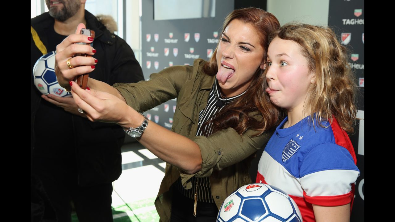 U.S. soccer player Alex Morgan takes a selfie with a young fan at a sponsor's event in New York on Monday, February 22.