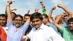 Hardik Patel (C), an organiser of the Patidar community, gathers with group members for a rally demanding "Other Backward Class" (OBC) status in Ahmedabad on August 23, 2015. OBC members have urged the Gujarat government not to grant the Patel, or Patidar, community the status, which grants official protection of the members' social and educational development. AFP PHOTO / Sam PANTHAKY        (Photo credit should read SAM PANTHAKY/AFP/Getty Images)