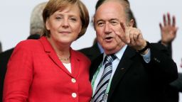 BERLIN - JUNE 30:  German Chancellor Angela Merkel chats to FIFA President Sepp Blatter prior to the FIFA World Cup Germany 2006 Quarter-final match between Germany   and Argentina played at the Olympic Stadium on June 30, 2006 in Berlin, Germany.  (Photo by Martin Rose/Bongarts/Getty Images)