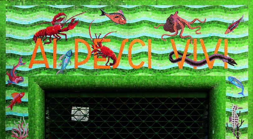 A mosaic sign integrating fish and waves with the lettering in Sestri Levante (Genoa).