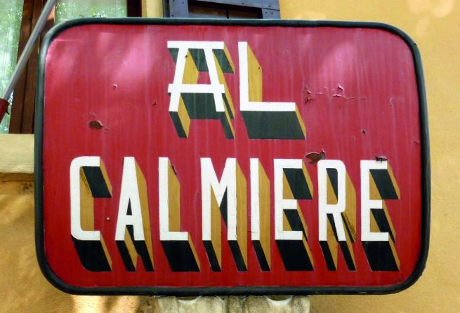 A tin plate sign for the Al Calmiere restaurant in Verona.