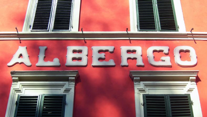 Stucco Tuscan letters on the Albergo Corona in Bagni di Lucca.