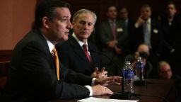 Republican presidential candidate Sen. Ted Cruz (R-TX) (L) and Texas Governor Greg Abbott (R) participate in a news conference December 8, 2015 on Capitol Hill in Washington, DC.