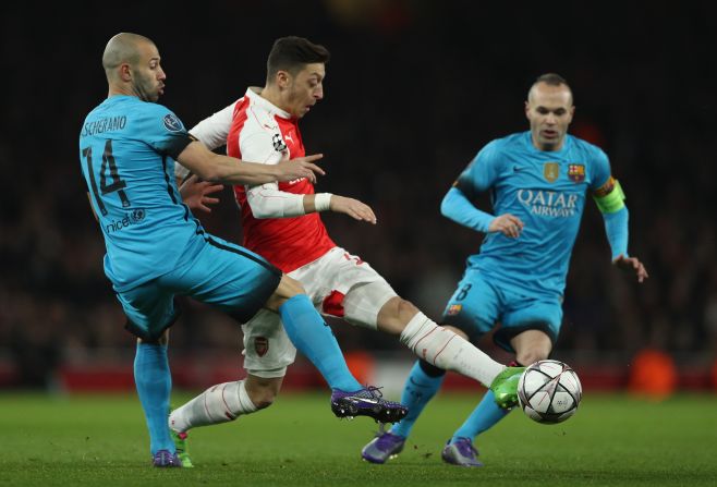 Arsenal, second in the English Premier League, started well with Mesut Ozil finding space against the Catalan club.