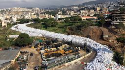 Piles of waste resemble a river of garbage in the Lebanese capital, Beirut, on Wednesday, February 24. Lebanon canceled a plan to export its waste to Russia, sending the country's ongoing waste crisis back to square one as mountains of trash choke the air and streets.