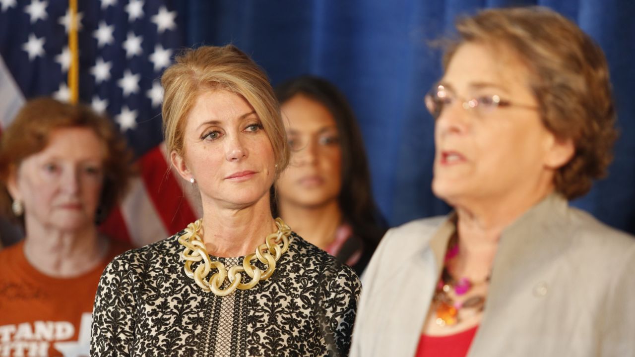 Meanwhile, Wendy Davis' 2013 filibuster propelled her to the Democratic Party's nomination for Texas governor. Here, she listens as Houston City Council member Ellen Cohen speaks about the law in October 2014, just weeks before Davis was defeated by Republican Greg Abbott.