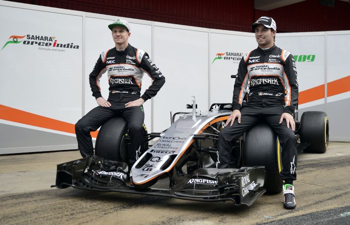 Force India's Nico Hulkenberg (left) and Sergio Perez (right) find a new use for the VJM09 car as it is unveiled in winter testing. Let's just hope those tires are super-soft and not hard to sit on.