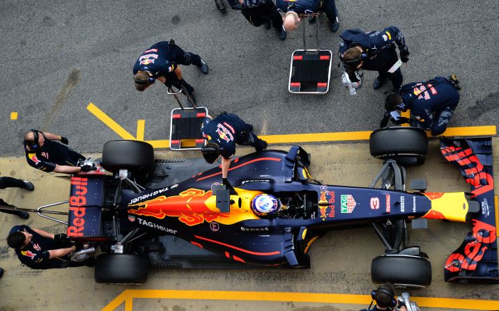 Looking good from above. The Red Bull Racing pit crew get set as Ricciardo brings his new racer back into the pits at the Circuit de Catalunya, the home of F1's winter testing.