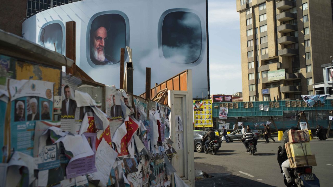 A picture of Iran's first supreme leader, Ayatollah Ruhollah Khomeini, lurks behind campaign posters in Tehran. Iran is holding elections on Friday, February 26. For the first time, Iranians will vote to elect <a href="http://www.cnn.com/2016/01/22/middleeast/iran-elections/" target="_blank">two important government bodies</a> at the same time: the parliament and the Assembly of Experts. The Assembly of Experts chooses the supreme leader.