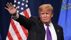 LAS VEGAS, NV - FEBRUARY 23:  Donald Trump Jr. (L) looks on as his father, Republican presidential candidate Donald Trump, waves after speaking at a caucus night watch party at the Treasure Island Hotel & Casino on February 23, 2016 in Las Vegas, Nevada. The New York businessman won his third state victory in a row in the "first in the West" caucuses.  (Photo by Ethan Miller/Getty Images)