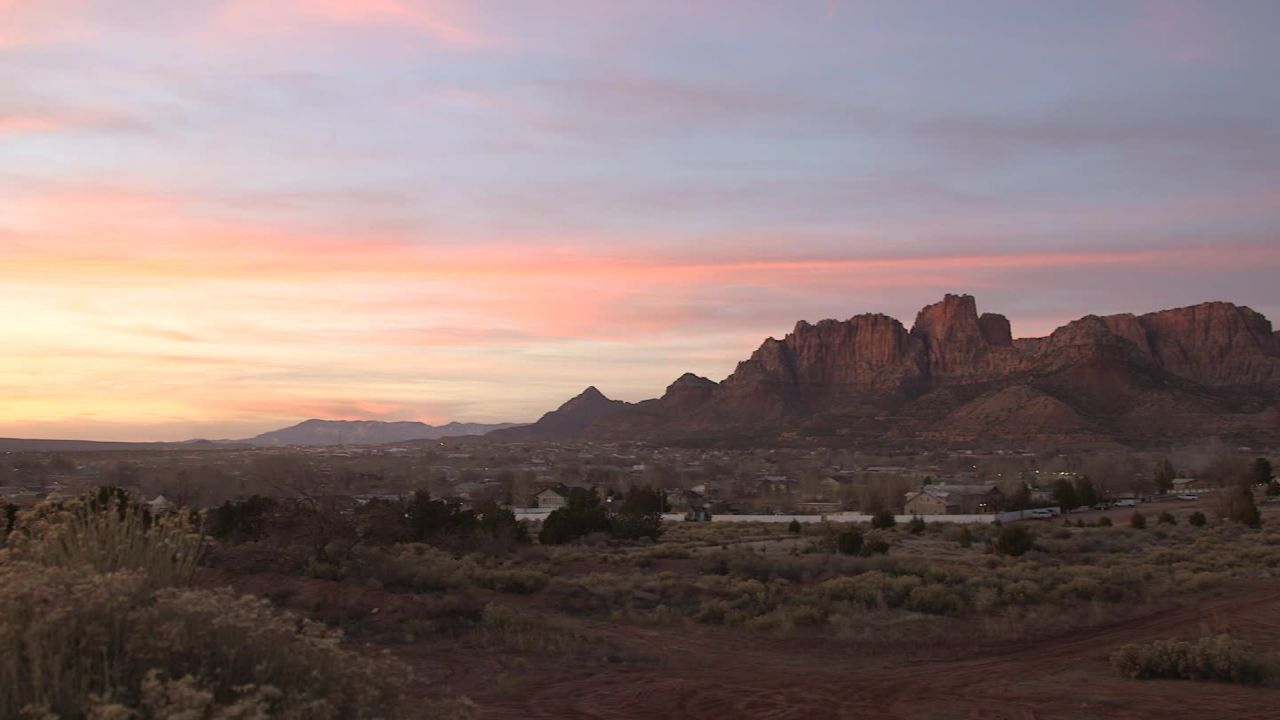 Hildale, Utah, and Colorado City, Arizona, nestle against red cliffs and together are known as Short Creek.