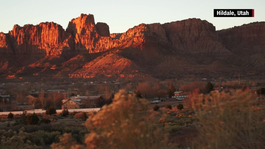 Hildale, Utah, and Colorado City, Arizona, are nestled at the foot of breathtaking red rock cliffs.