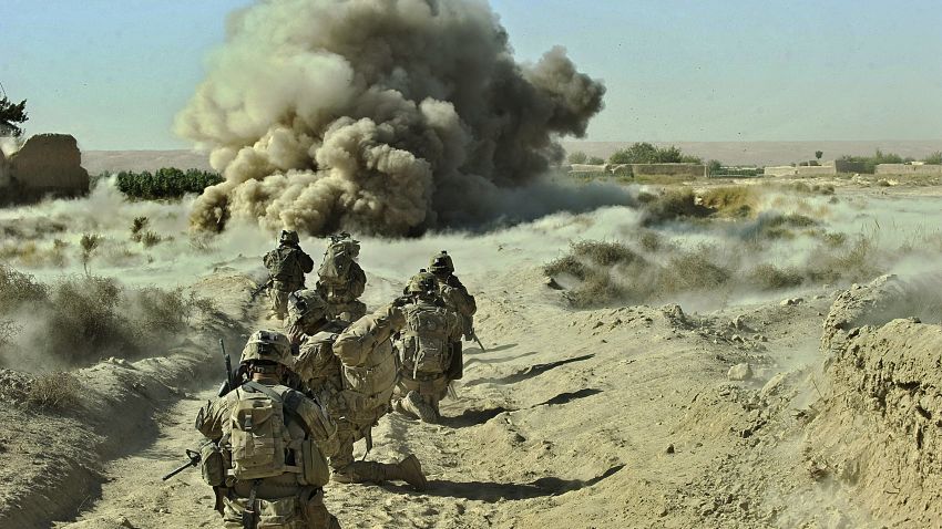 (FILES) In this photograph taken on September 23, 2012, dust kicks off the ground during an operation by US Army soldiers attached to the 2nd platoon, C-Coy. 1-23 Infantry based at Zangabad foward operating base in Panjwai ditrict after Anti Personnel Obstacle Breaching System -- abbreviated as A-POBS (charges fired by rocket and trigger safe detonation of IED's used to make roadside bombs) -- detonate on a nearby road during a dawn operation at Naja-bien village.   With the end of the US surge in Afghanistan, the Taliban have survived the biggest military onslaught the West will throw at them -- and fears are growing that a disastrous new civil war looms. The last of the extra 33,000 soldiers President Barack Obama deployed nearly three years ago left late last month, and the remaining NATO force of some 112,000 will follow by the end of 2014.    AFP PHOTO/Tony KARUMBA/ FILES        (Photo credit should read TONY KARUMBA/AFP/Getty Images)