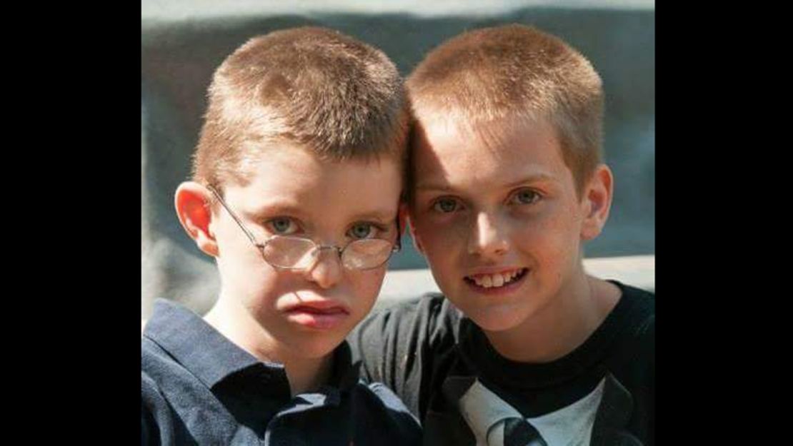 Jacob, left, with his older brother John, in 2013. Jacob has a rare disease discovered by an online gene matchmaker service that researchers are developing. 