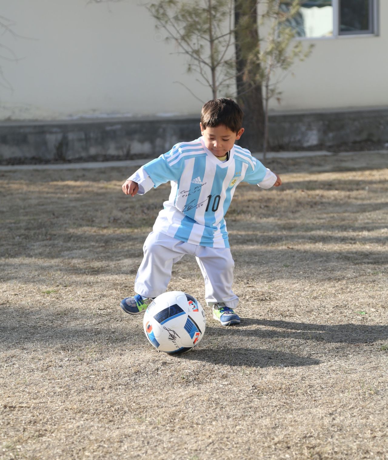 Murtaza shows off his skills with his Messi-autographed football.