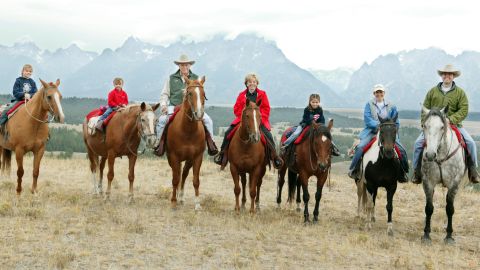 Then-Vice President Dick Cheney with his family: From left to right, granddaughters Katie Perry, 10, Grace Perry, 5, Dick Cheney, Lynne Cheney, granddaughter Elizabeth Perry, 7, daughter Liz Cheney Perry, and son-in-law Phillip Perry August 18, 2004 near Moose, Wyoming.