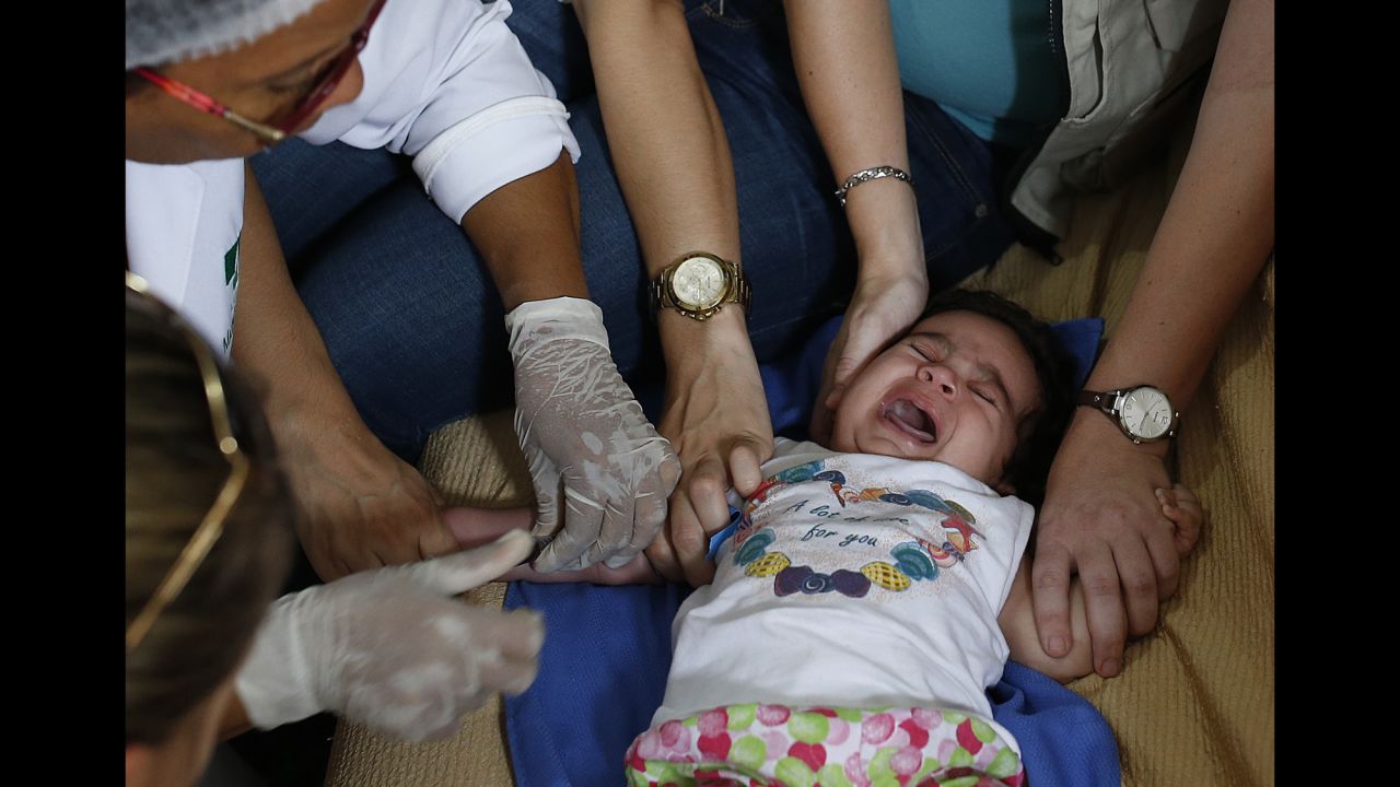 Health workers draw blood from 3-month-old Esther Kamilly at her home in Joao Pessoa, Brazil, on Wednesday, February 24. It was part of a study on the mosquito-borne <a href="http://www.cnn.com/2016/01/26/health/gallery/zika-virus/index.html" target="_blank">Zika virus,</a> which is prompting worldwide concern because of its rapid spread across the globe and its connection to a neurological birth disorder.
