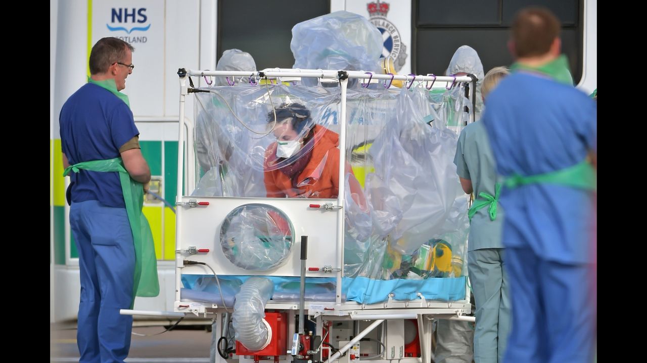 Pauline Cafferkey enters an isolation tent before boarding a military airplane in Glasgow, Scotland, on Tuesday, February 23. The Scottish nurse <a href="http://www.cnn.com/2016/02/23/health/uk-ebola-nurse-hospitalized-again/" target="_blank">was transported to a London hospital</a> to be treated for a complication related to Ebola, which she contracted in Sierra Leone 14 months ago.