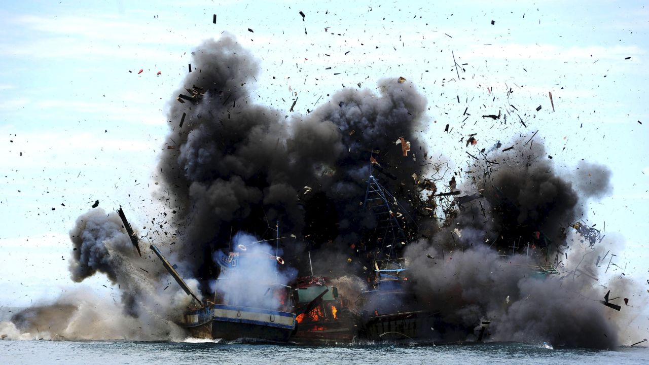 Boats confiscated for illegal fishing are destroyed by Indonesian authorities on Monday, February 22. 