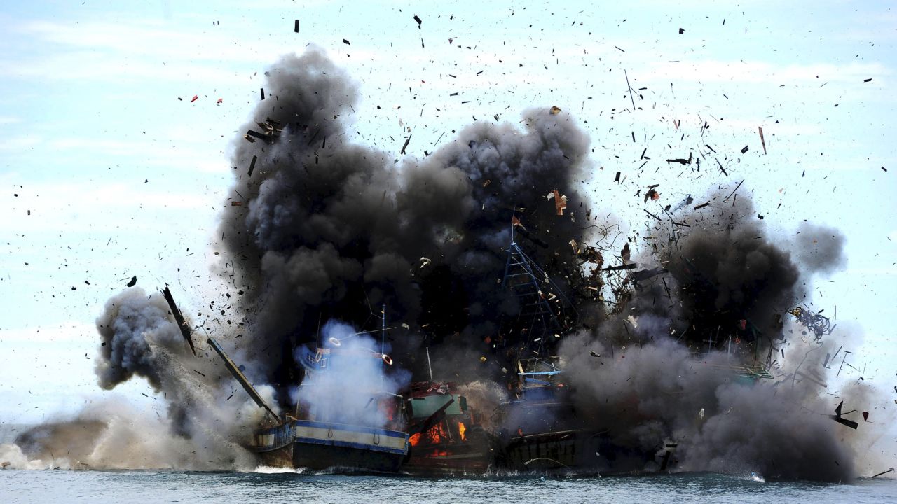 Boats confiscated for illegal fishing are destroyed by Indonesian authorities on Monday, February 22.
