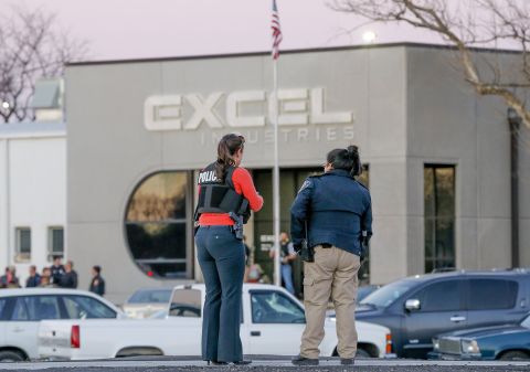 Police guard  Excel Industries. The sheriff told reporters authorities first received a report of a man having been shot while driving. Second, a person was reported shot in the leg. Third, a report came in about a shooting in the parking lot of Excel. Finally, an active shooter was reported inside the workplace.