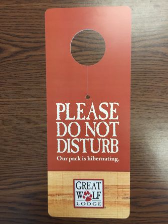Great Wolf Lodge, a chain of water park resorts throughout North America, pays homage to its "rustic" aesthetic and family fun with these wooden "Do Not Disturb" signs.