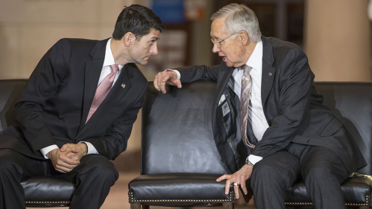 House Speaker Paul Ryan talks with Senate Minority Leader Harry Reid on Capitol Hill on Wednesday, February, 24, during a tribute to civil rights legend Rep. John Lewis of Atlanta.