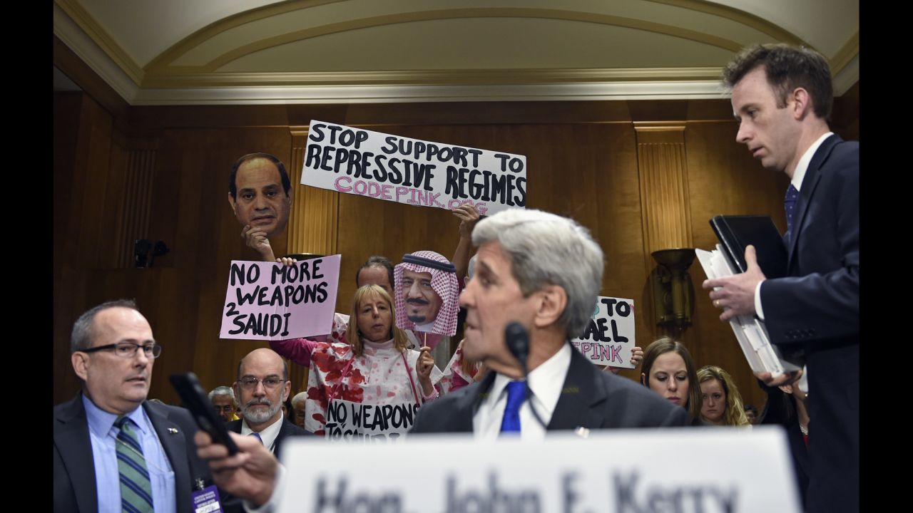 Code Pink co-founder Medea Benjamin, back left, leads demonstrators on Capitol Hill on Tuesday, February 23, as Secretary of State John Kerry prepares to testify before the Senate Foreign Relations Committee hearing on the State Department's fiscal 2017 budget.