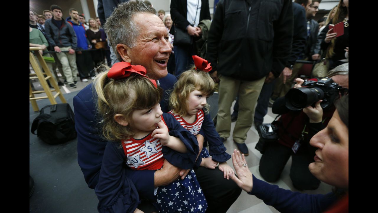 Ohio Gov. John Kasich, a Republican presidential candidate, poses for pictures at a campaign town hall event at George Mason University in Fairfax, Virginia, on Monday, February 22. 