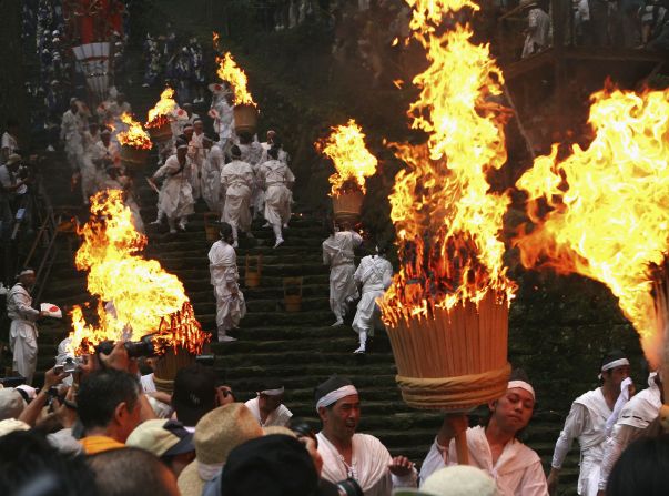 Nothing's quite as thrilling as watching hundreds of young Japanese men rush down a steep staircase with 50-kilo torches.